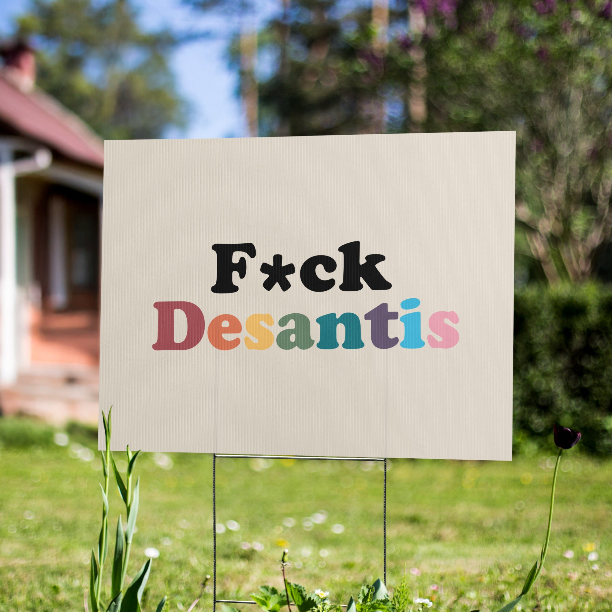 Cartel de jardín que dice "A la mierda con Desantis"